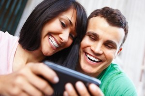 Young couple playing relationship games online Relationship games are now apps on smart phones